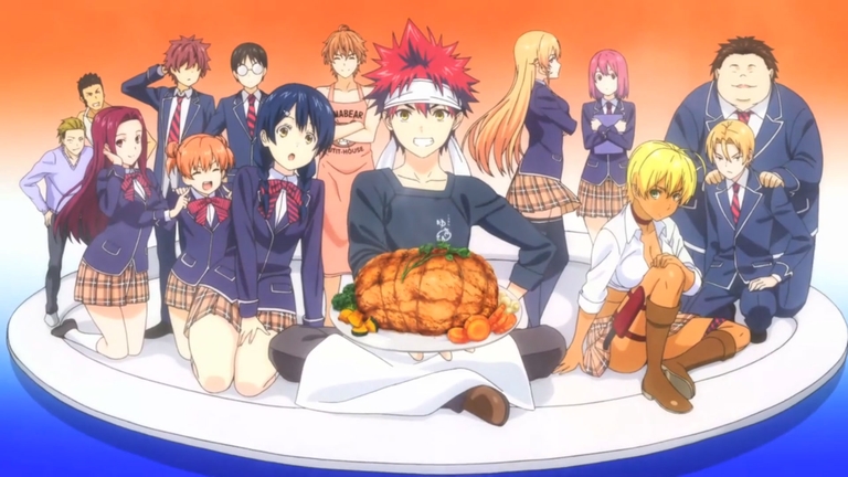 The main cast of the anime series Food Wars! (Shokugeki no Soma) are gathered together, with protagonist Soma Yukihira in the center holding a large roasted dish.