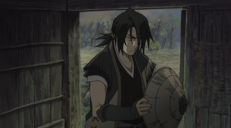 No-Name stands in a traditional building