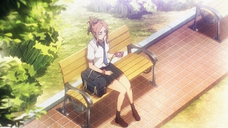 A young woman with her hair in a bun sits on a park bench, holding a small item, in this tranquil anime scene.