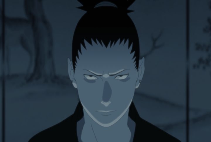 Shikamaru Nara displays a resolute and determined expression, fueled by his vow for vengeance after Asuma's passing in Naruto Shippuden.