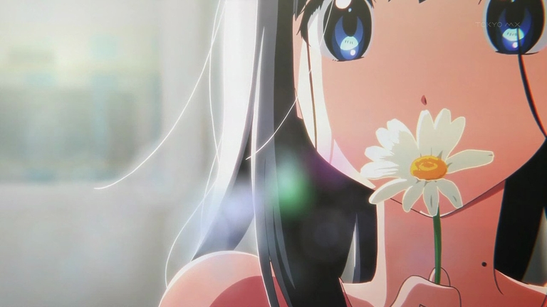 Tamako Kitashirakawa holding a white daisy