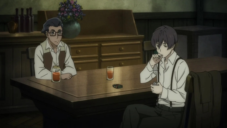 Avilio Bruno sitting at a table in a dimly lit room during an episode of 91 Days