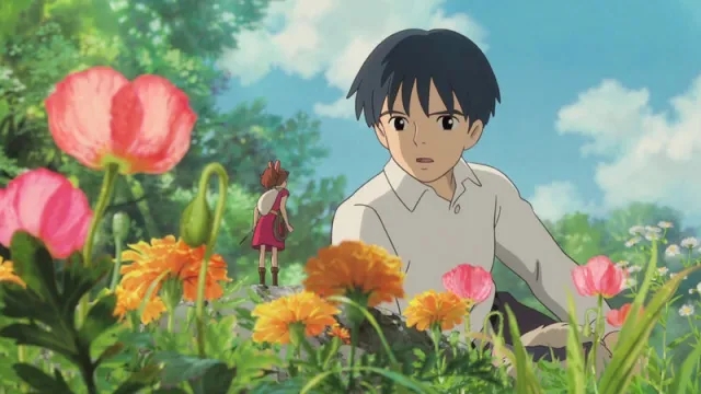 Shawn looks at Arrietty in flowers