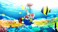 Ononoki Yotsugi underwater surrounded by coral