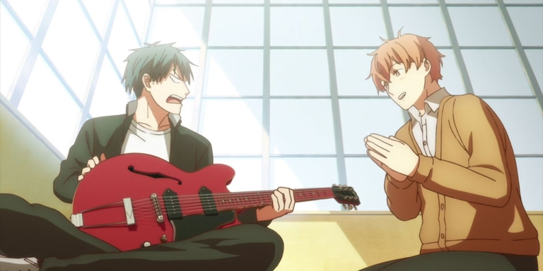Ritsuka holding Mafuyu's Gibson guitar