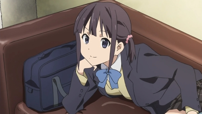 Iori relaxing on a couch showing her more vulnerable side away from the club