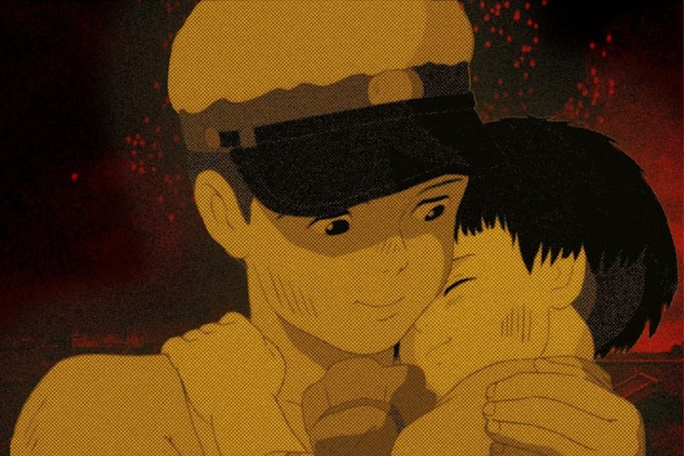 Seita embraces his younger sister Setsuko amidst a backdrop of fire and destruction in the animated war film Grave of the Fireflies.