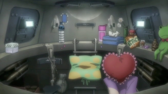 The cluttered interior of a tank cockpit in Girls und Panzer, decorated with various personal items