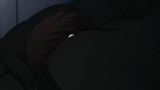 Ugetsu Murata peeking out from under his bed covers in the anime series Given.