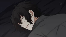 Ugetsu Murata peacefully sleeping in his bed in the anime series Given.